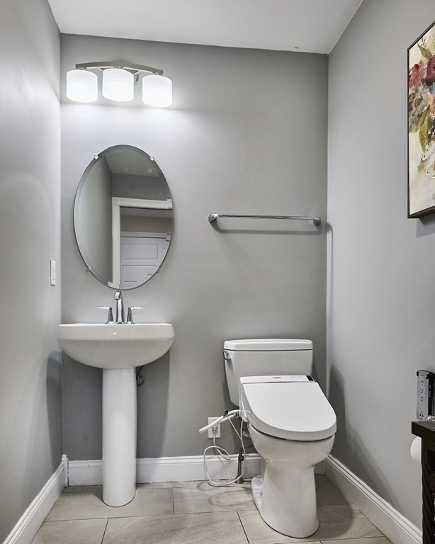 107 Concord Way Amherst, MA 01002 - Photo 32 of 41 a bathroom with a toilet a sink and a mirror