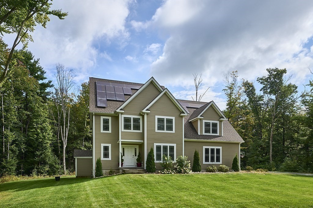 107 Concord Way Amherst, MA 01002 - Photo 36 of 41 a front view of a house with a yard