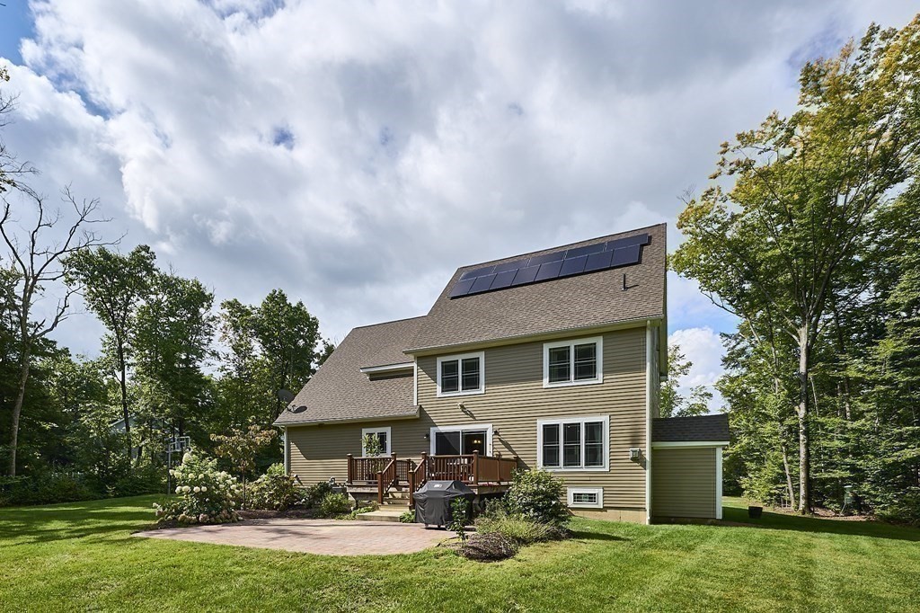 107 Concord Way Amherst, MA 01002 - Photo 37 of 41 a front view of a house with garden and trees