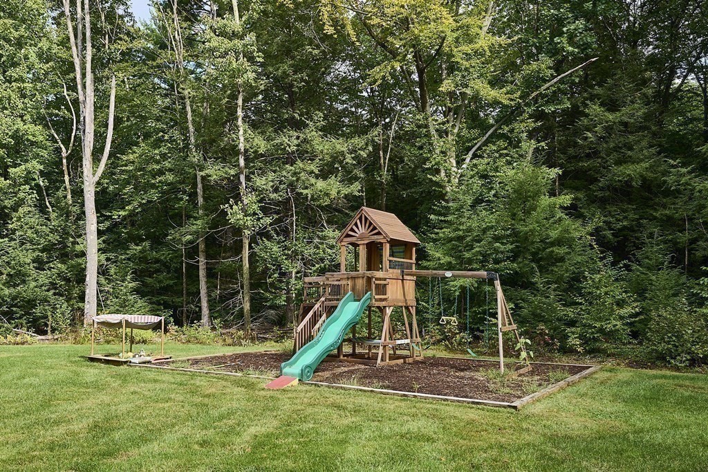 107 Concord Way Amherst, MA 01002 - Photo 40 of 41 a view of a house with a backyard and a slide