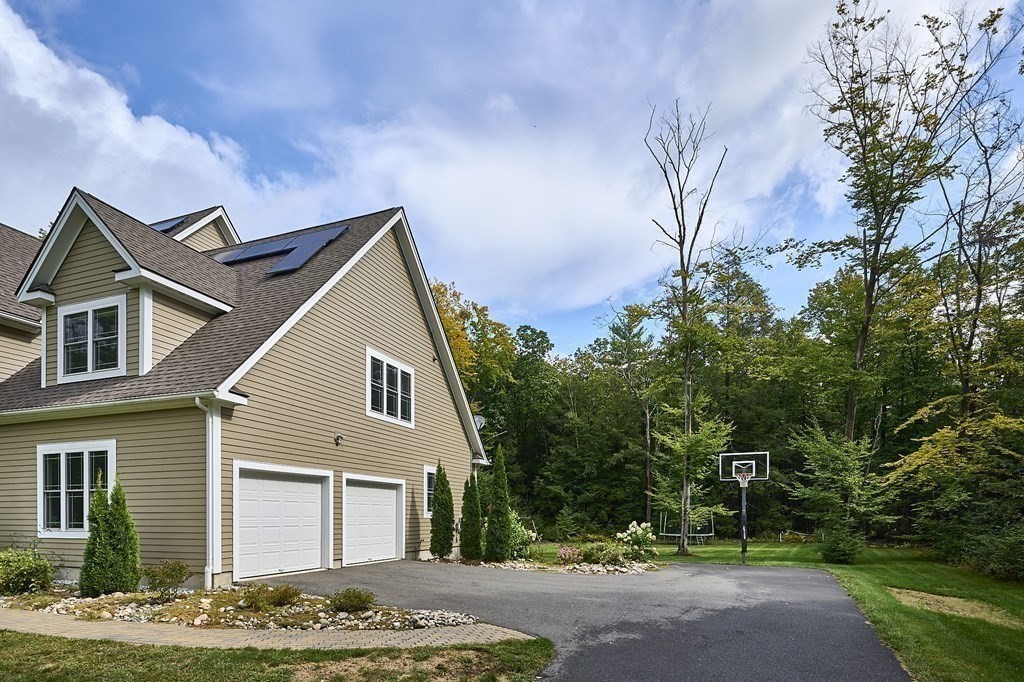 107 Concord Way Amherst, MA 01002 - Photo 6 of 41 a front view of a house with a yard