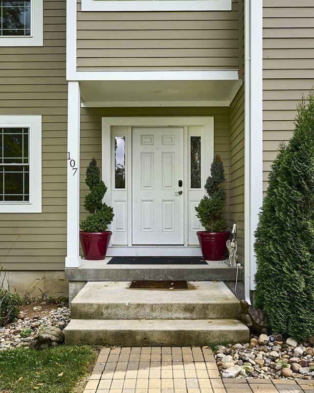 107 Concord Way Amherst, MA 01002 - Photo 7 of 41 a front view of a house with plants