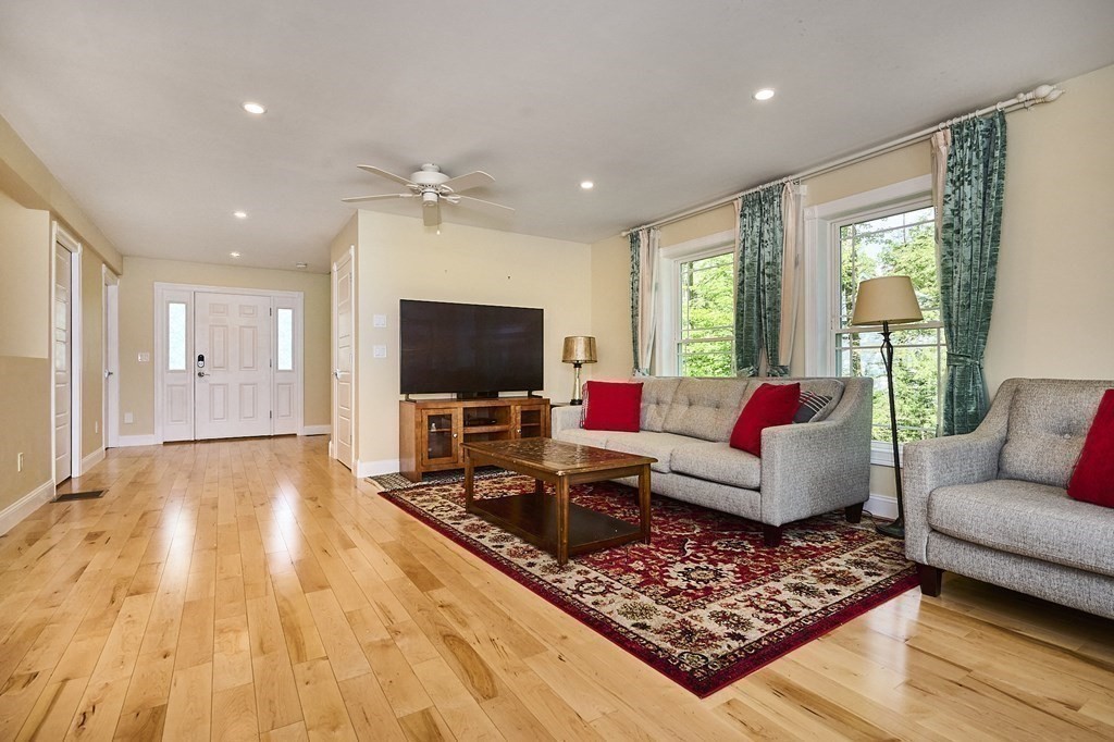 107 Concord Way Amherst, MA 01002 - Photo 10 of 41 a living room with furniture and a flat screen tv