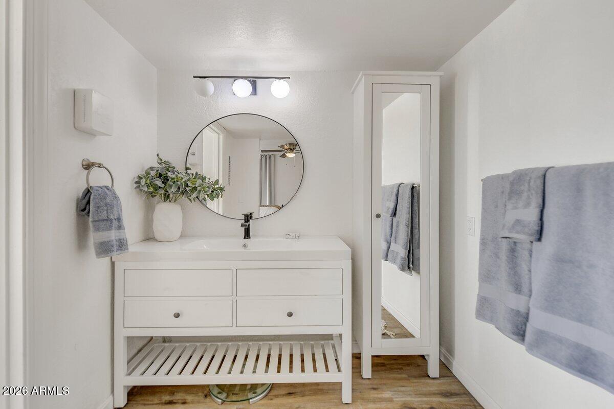 1301 West Rio Salado Parkway, Unit 51 Mesa, AZ 85201 - Photo 13 of 30 a bathroom with a sink a mirror and a shower