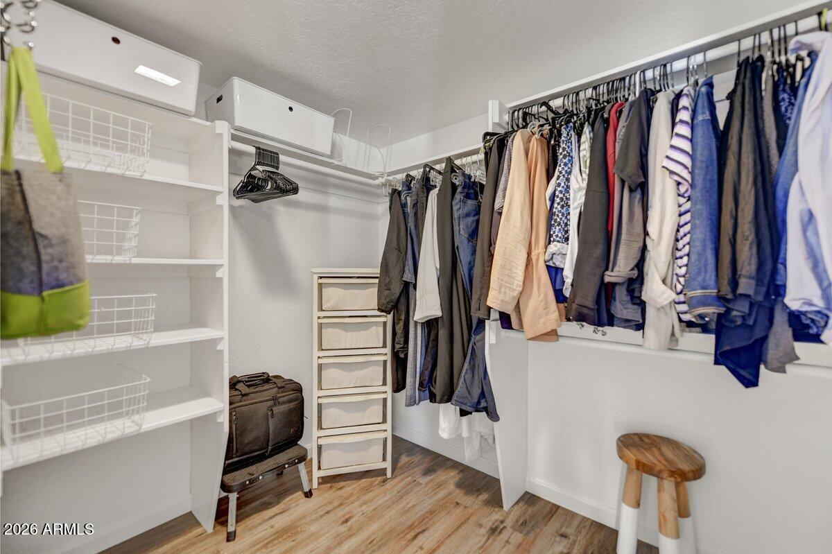 1301 West Rio Salado Parkway, Unit 51 Mesa, AZ 85201 - Photo 17 of 30 a view of walk in closet with clothes and shoes