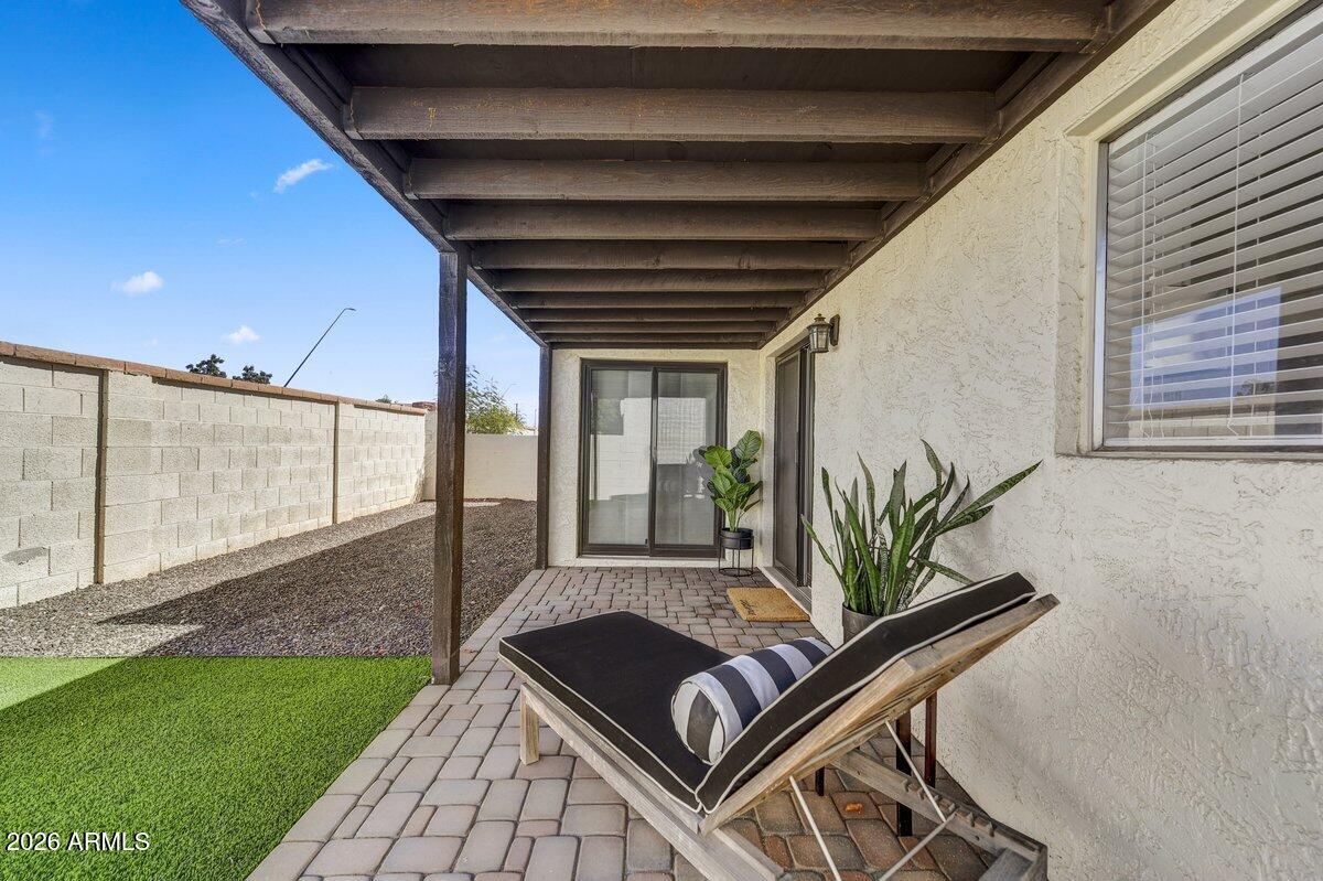 1301 West Rio Salado Parkway, Unit 51 Mesa, AZ 85201 - Photo 22 of 30 a backyard of a house with potted plants and couches