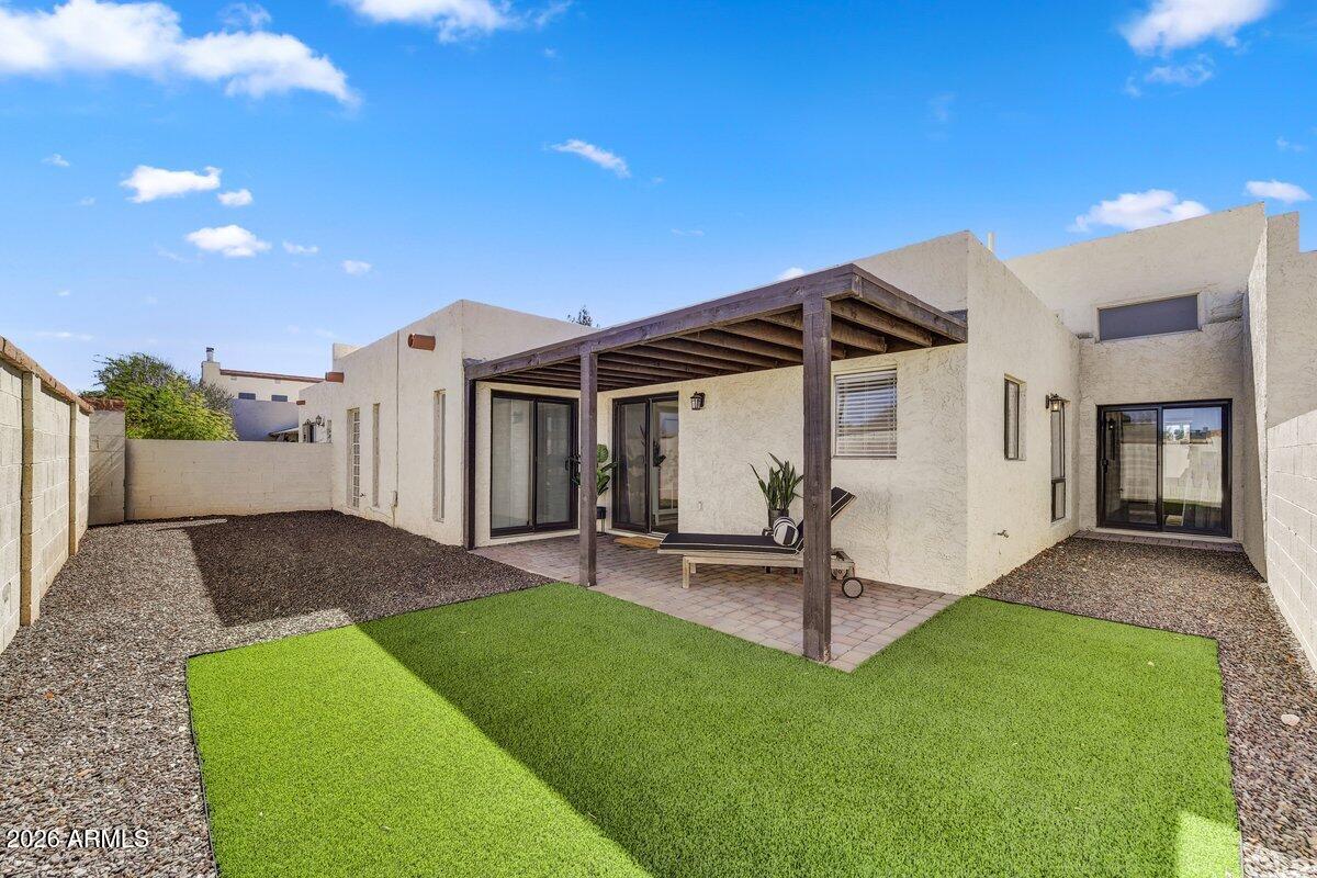 1301 West Rio Salado Parkway, Unit 51 Mesa, AZ 85201 - Photo 23 of 30 a view of a house with a yard and sitting area