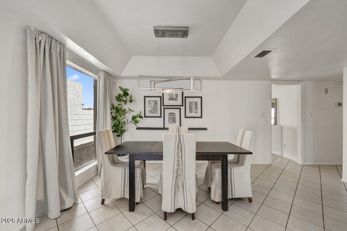 1301 West Rio Salado Parkway, Unit 51 Mesa, AZ 85201 - Photo 5 of 30 a view of a kitchen with furniture and an entrance