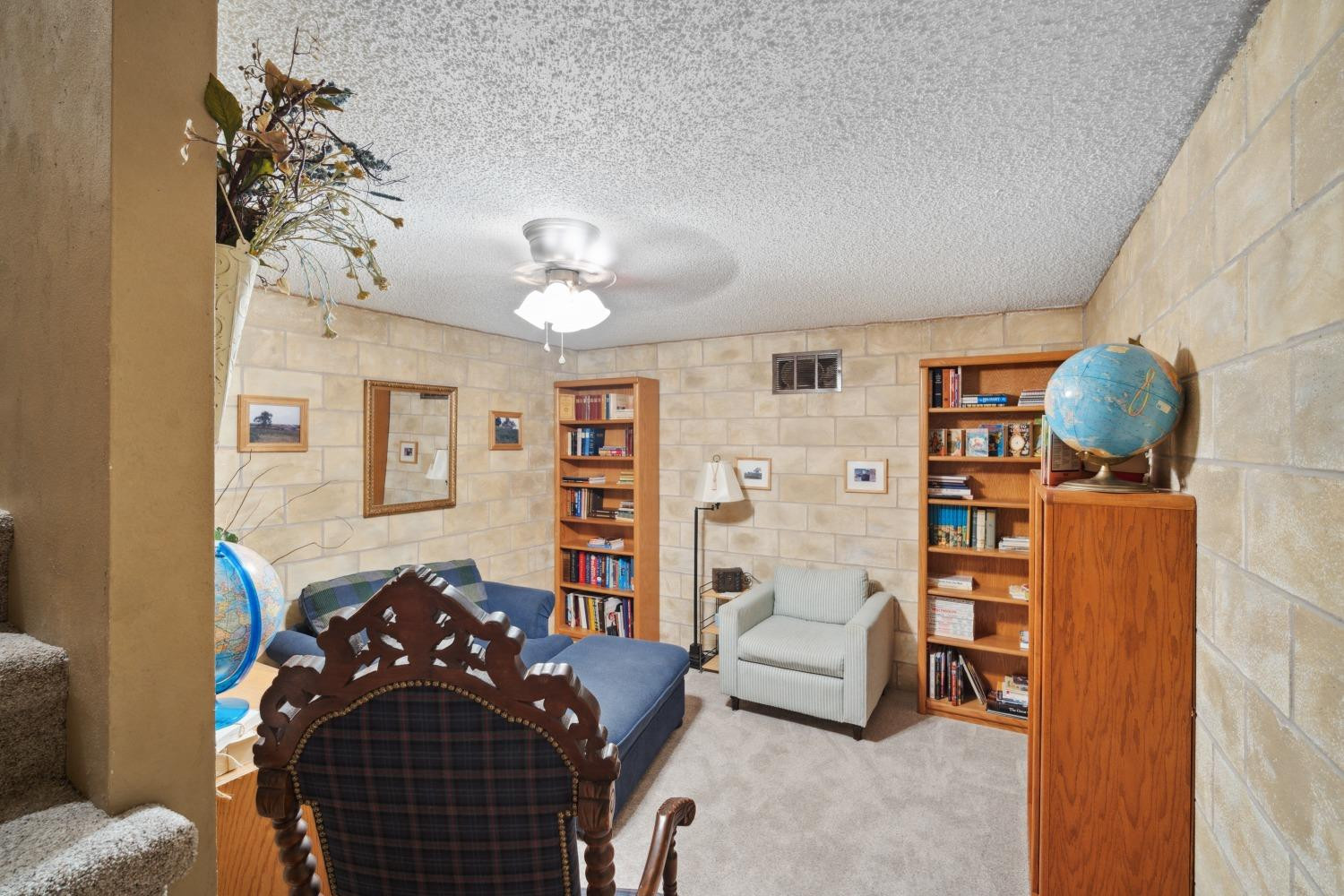 9002 Woodrow Road Wolfforth, TX 79382 - Photo 21 of 48 a bedroom with a bed and wooden floor