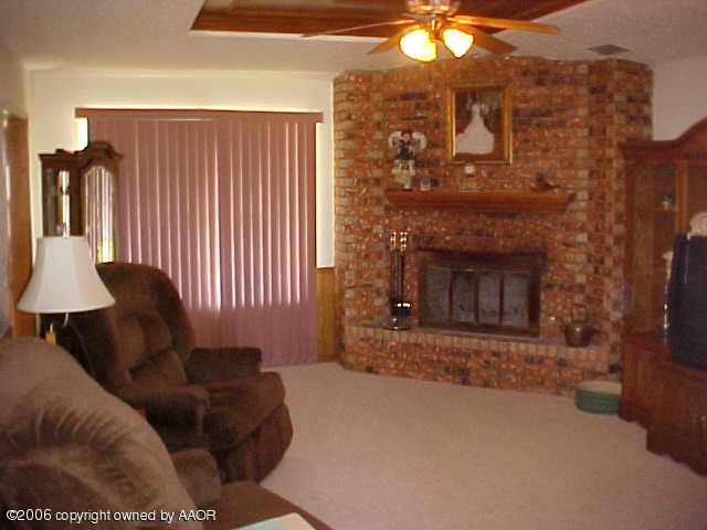 8407 Lamount Drive Amarillo, TX 79110 - Photo 5 of 12 a living room with furniture and a fireplace