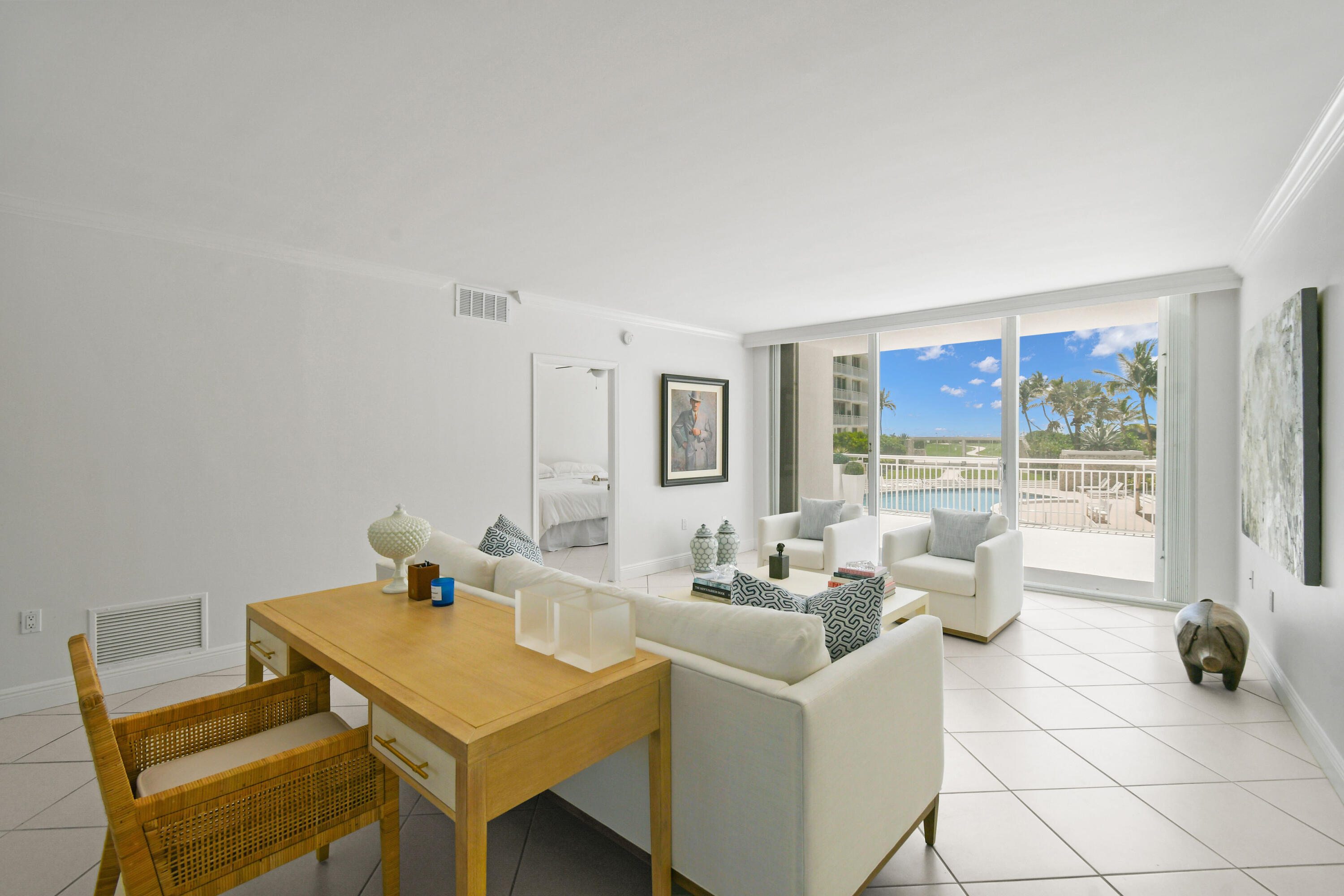2780 South Ocean Boulevard, Unit 112 Palm Beach, FL 33480 - Photo 2 of 55 a living room with furniture and a table