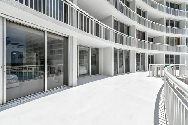 a view of a swimming pool with a patio
