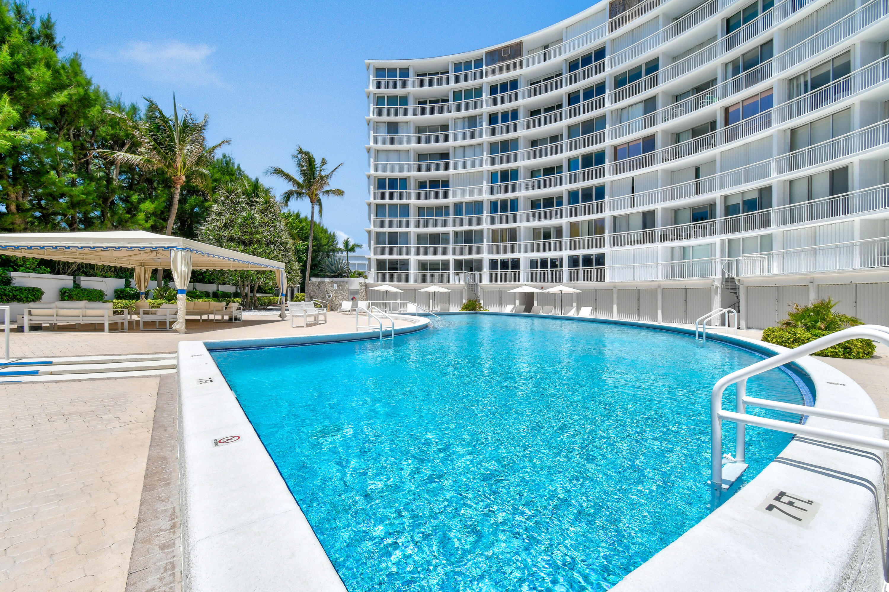 2780 South Ocean Boulevard, Unit 112 Palm Beach, FL 33480 - Photo 29 of 55 a view of swimming pool with outdoor seating and plants