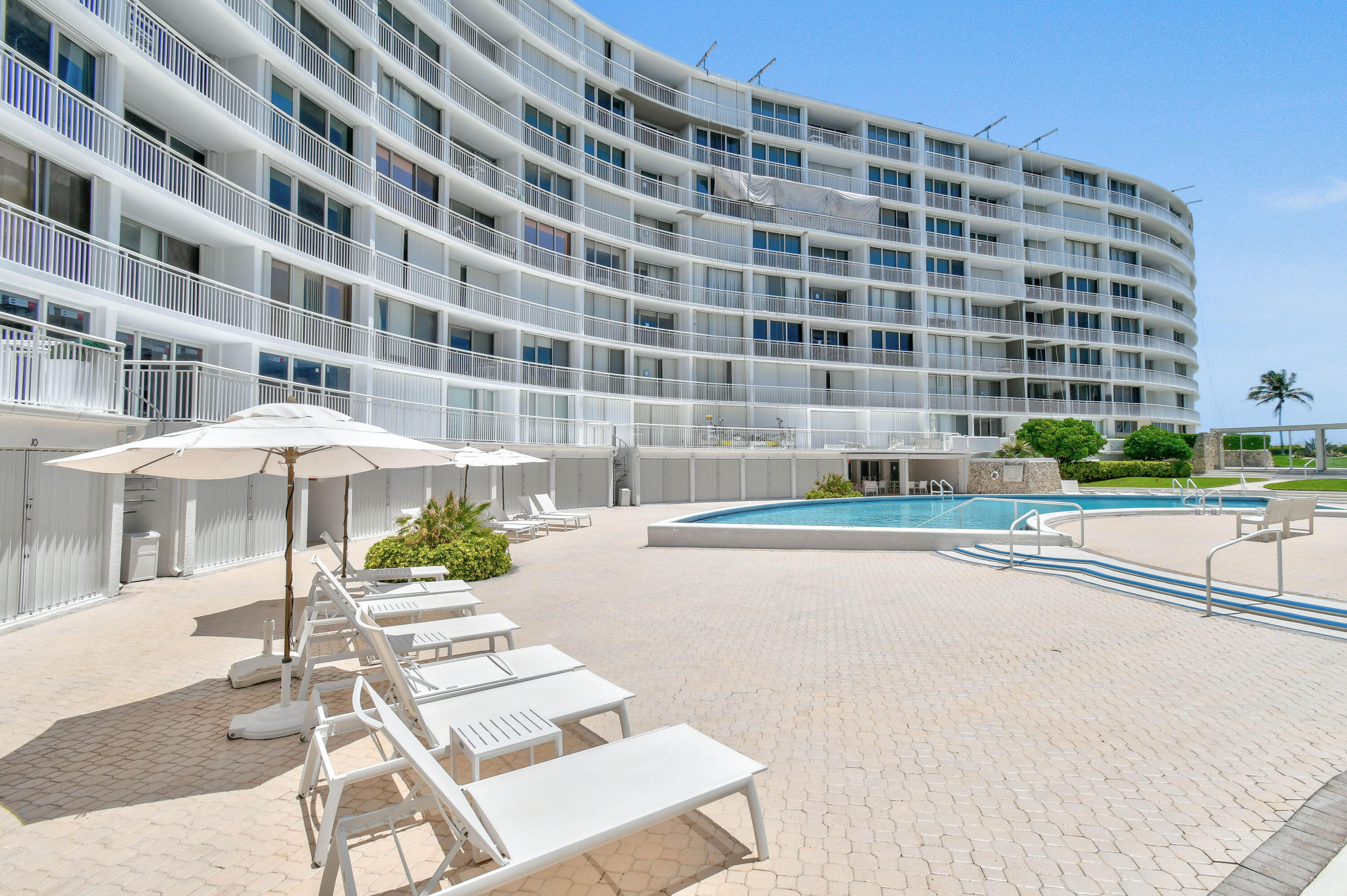 2780 South Ocean Boulevard, Unit 112 Palm Beach, FL 33480 - Photo 31 of 55 a view of a building with a yard