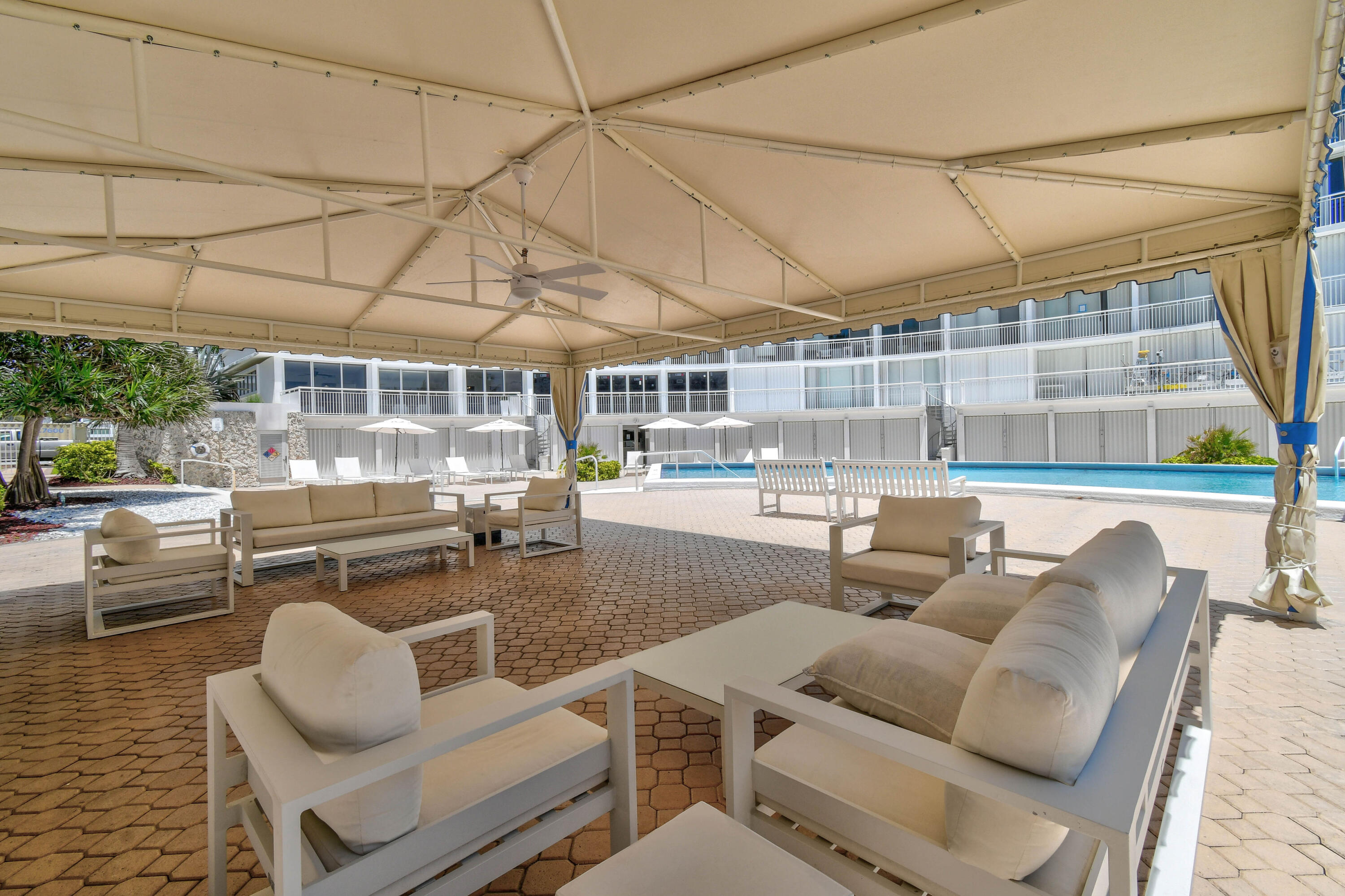 2780 South Ocean Boulevard, Unit 112 Palm Beach, FL 33480 - Photo 33 of 55 a dinning table and chairs in the patio