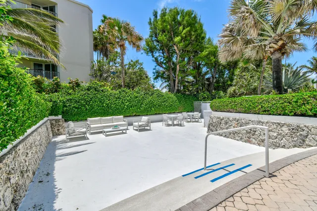 a view of a patio with wooden floor