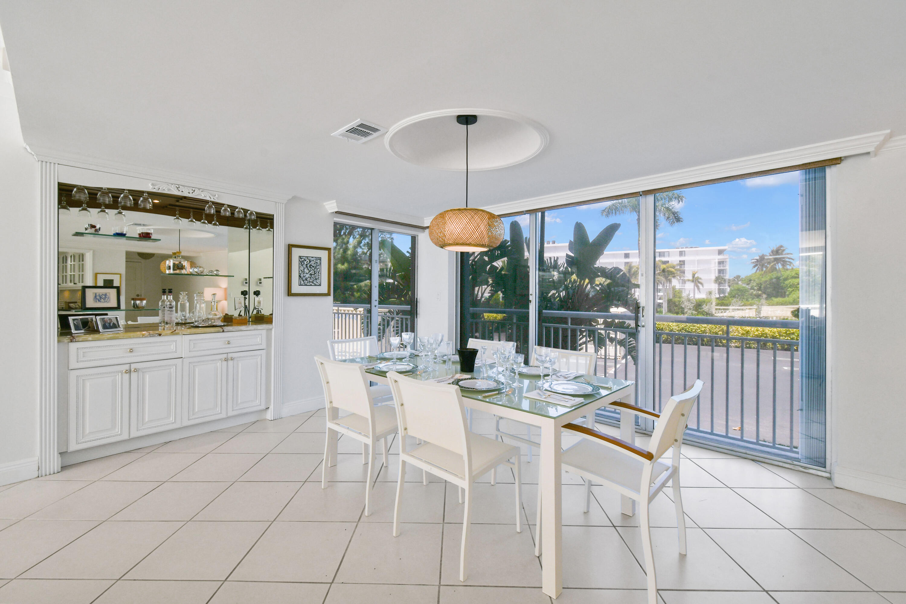 2780 South Ocean Boulevard, Unit 112 Palm Beach, FL 33480 - Photo 4 of 55 a view of a dining room with furniture wooden floor and chandelier