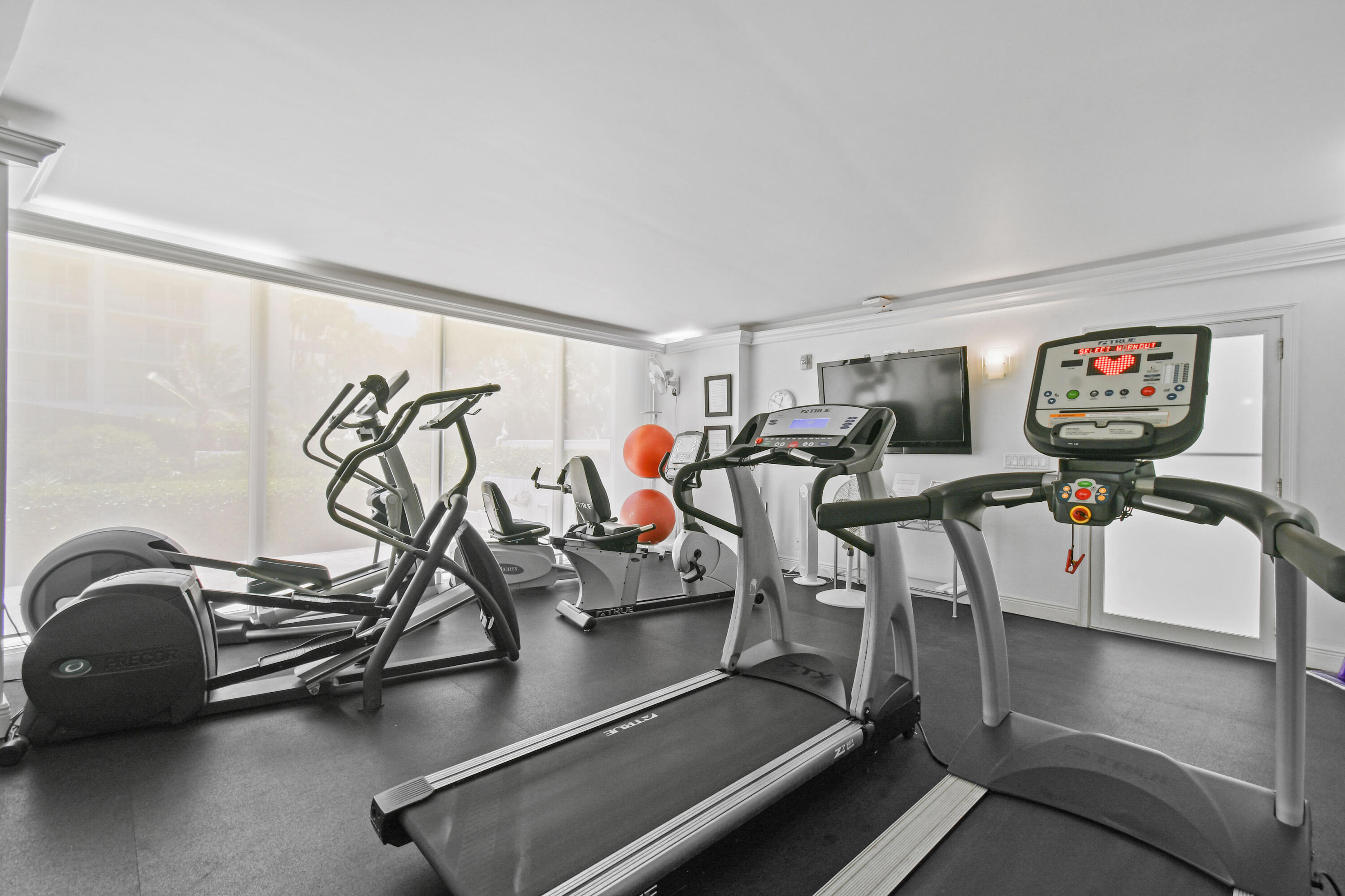 2780 South Ocean Boulevard, Unit 112 Palm Beach, FL 33480 - Photo 42 of 55 a room with gym equipment