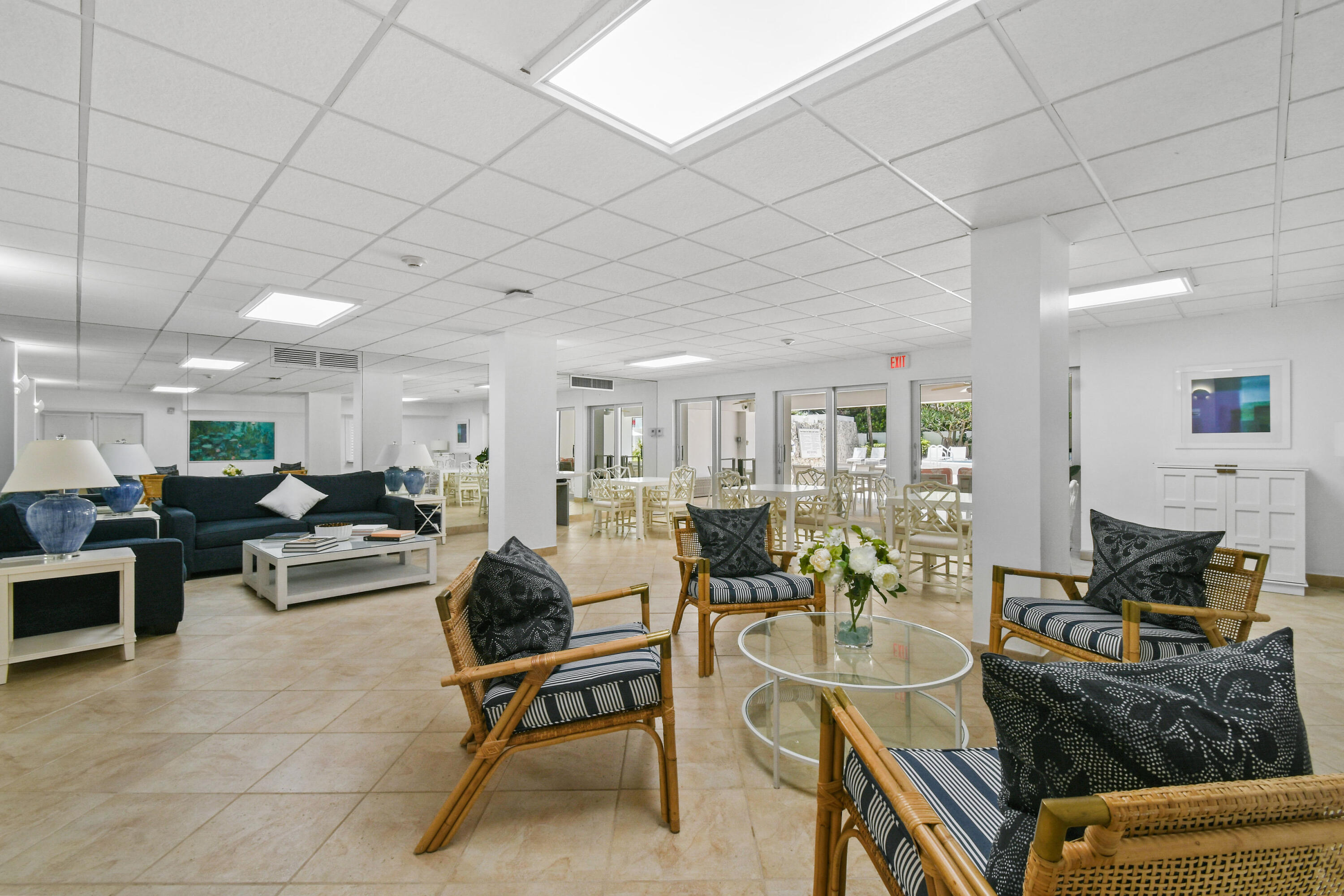 2780 South Ocean Boulevard, Unit 112 Palm Beach, FL 33480 - Photo 48 of 55 a living room with furniture a fireplace and a dining table with wooden floor