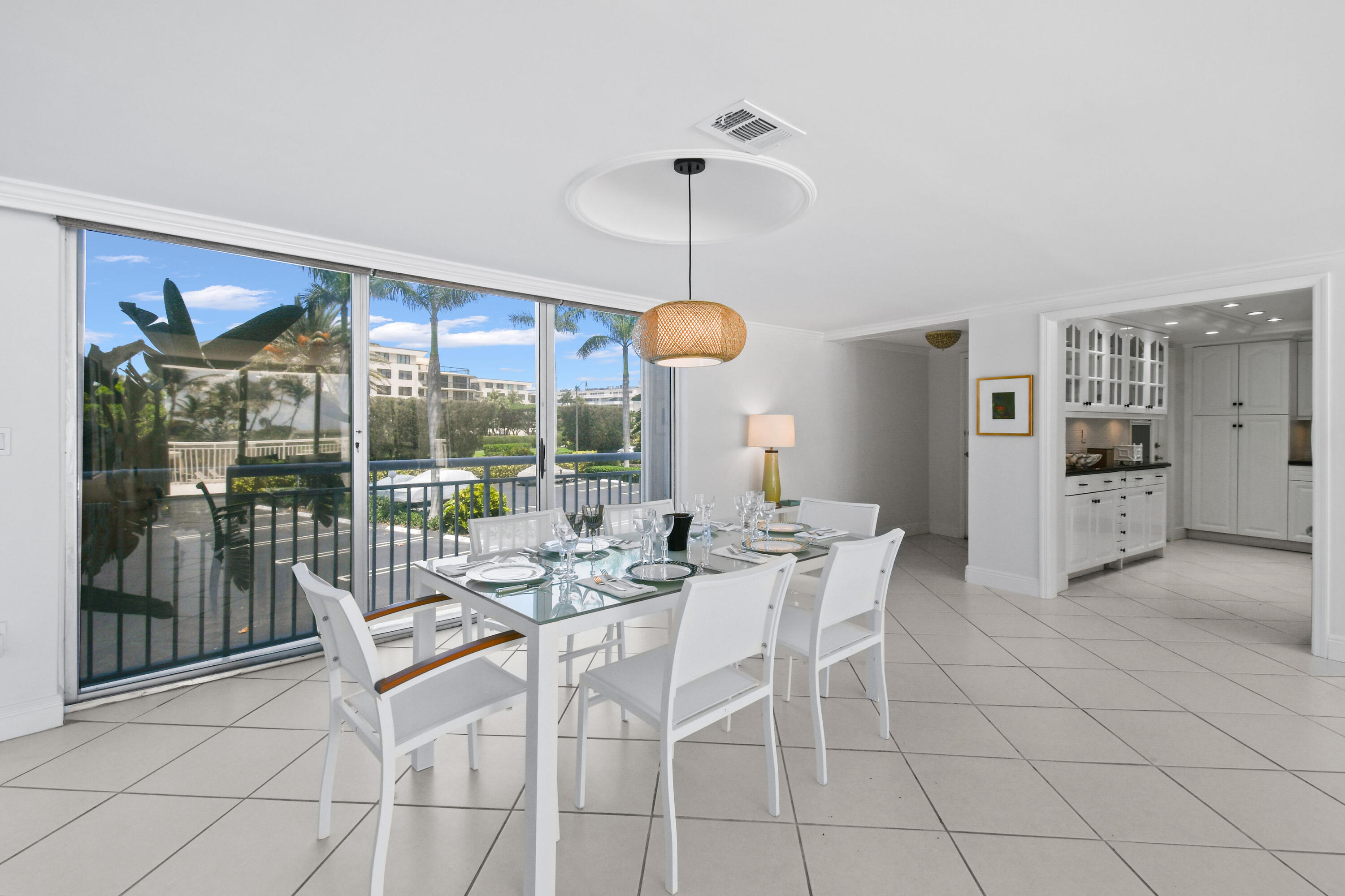 2780 South Ocean Boulevard, Unit 112 Palm Beach, FL 33480 - Photo 5 of 55 a view of a dining room with furniture wooden floor and chandelier
