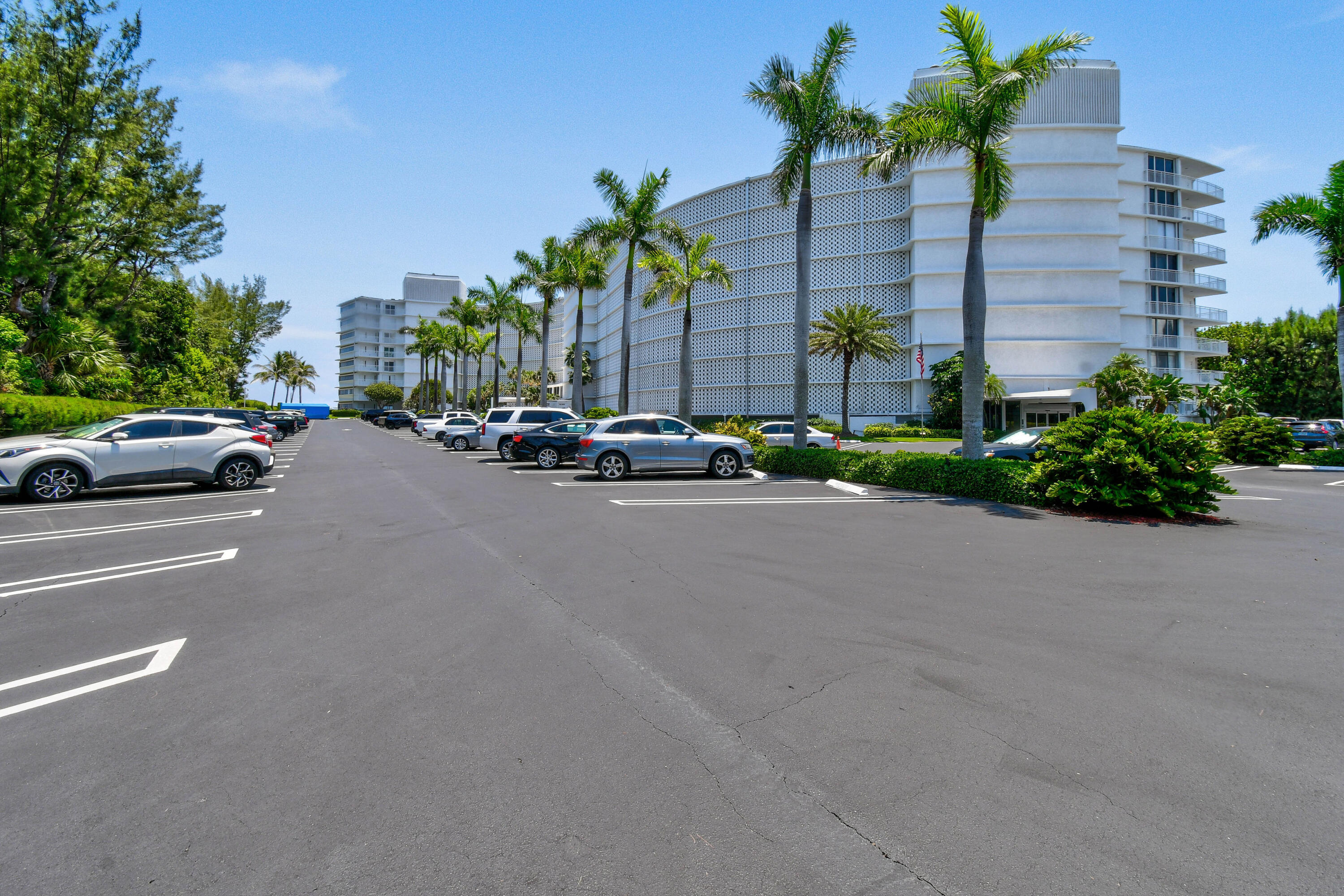 2780 South Ocean Boulevard, Unit 112 Palm Beach, FL 33480 - Photo 53 of 55 a view of a street with a cars parked and cars parked on the roadside