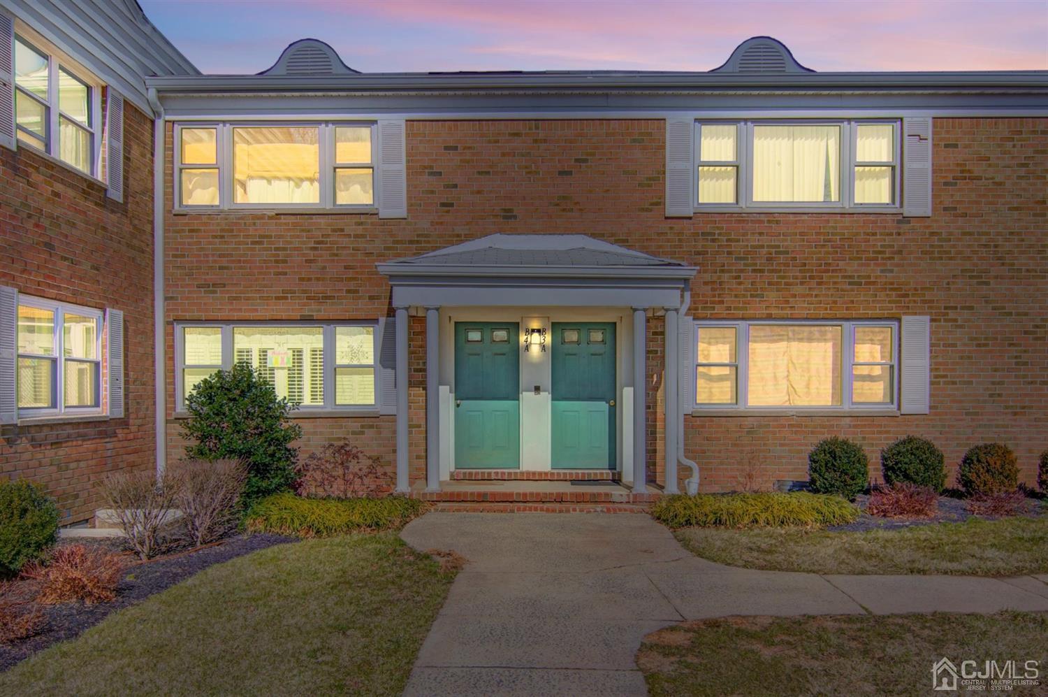 199 Evergreen Road, Unit 4B Edison, NJ 08837 - Photo 2 of 28 a front view of a house with garden
