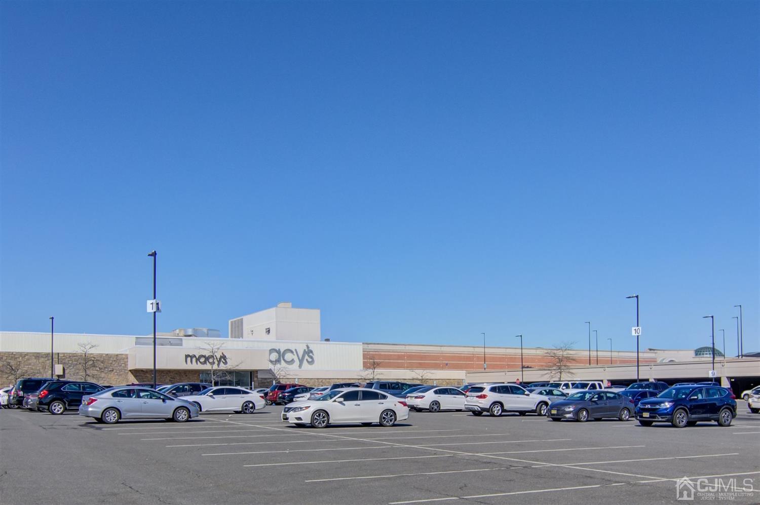 199 Evergreen Road, Unit 4B Edison, NJ 08837 - Photo 21 of 28 a large parking space with lots of cars parked in the background