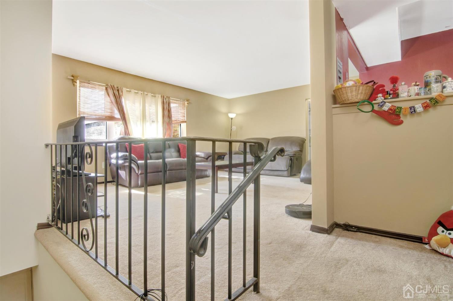 199 Evergreen Road, Unit 4B Edison, NJ 08837 - Photo 4 of 28 a view of a livingroom with furniture and a window