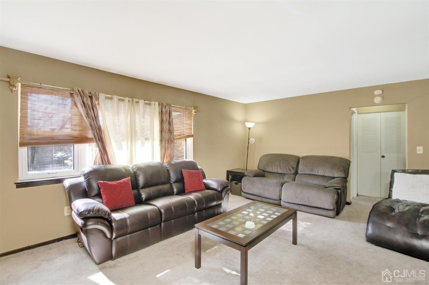 199 Evergreen Road, Unit 4B Edison, NJ 08837 - Photo 6 of 28 a living room with furniture and a large window