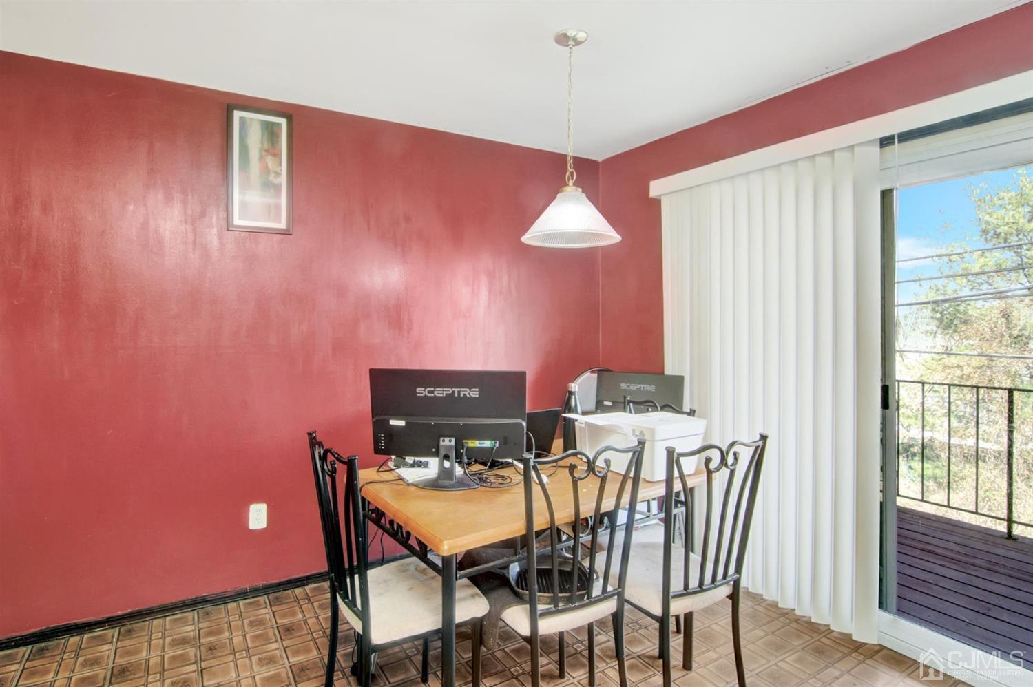199 Evergreen Road, Unit 4B Edison, NJ 08837 - Photo 10 of 28 a view of a dining room with furniture and wooden floor
