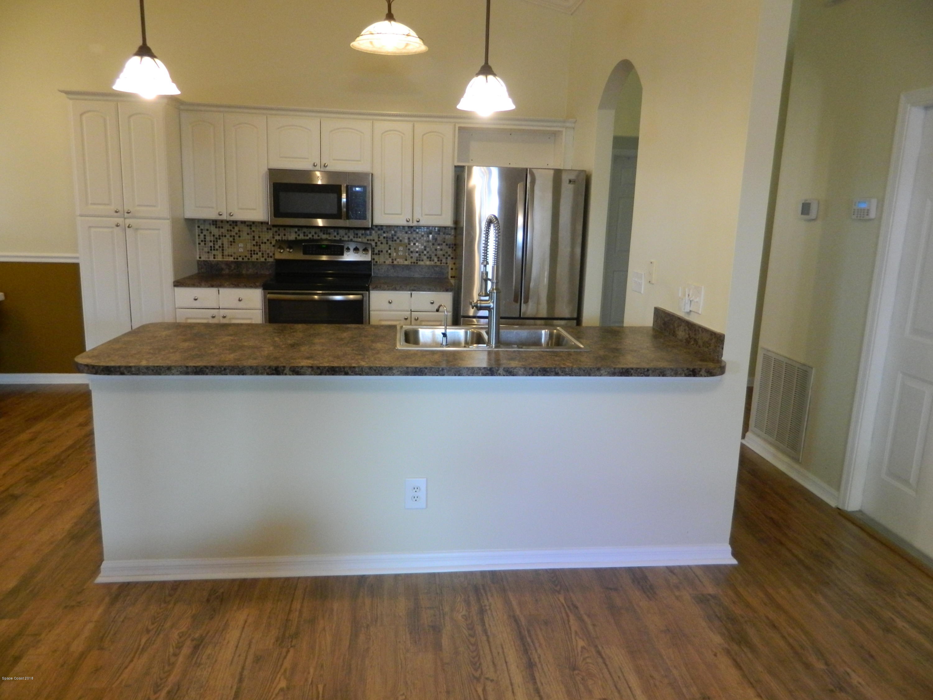 1778 Palm Ridge Road Melbourne, FL 32935 - Photo 5 of 19 Kitchen with island counter