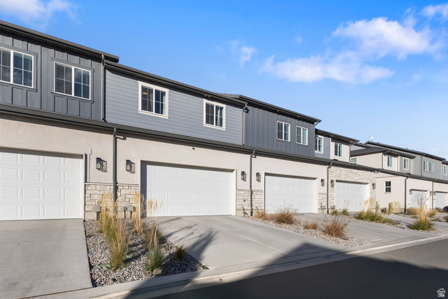 3473 Hardman Way Lehi, UT 84048 - Photo 21 of 22 Traditional-style house featuring stone siding, driveway, and a residential view