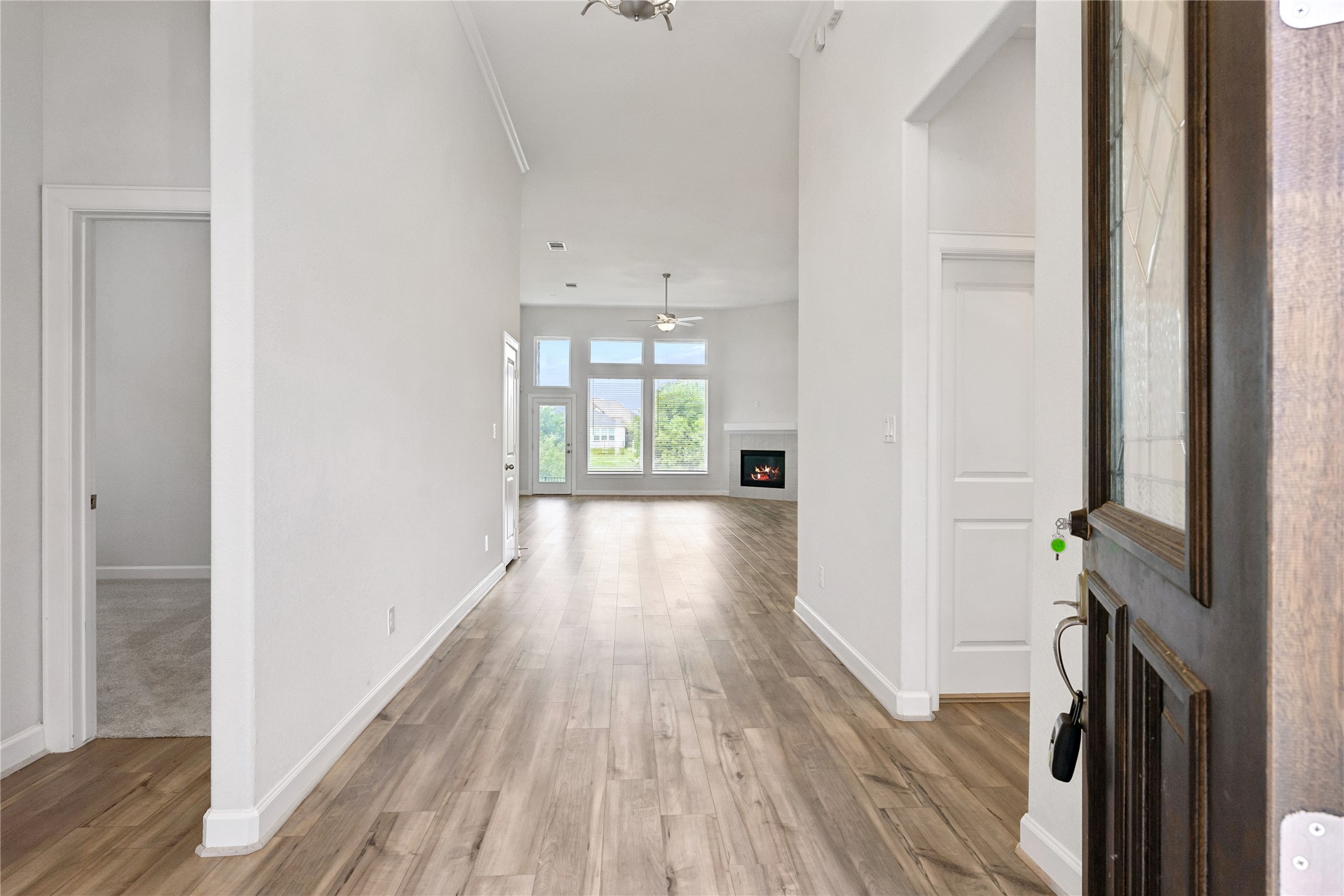 298 Wild Pecan Loop Buda, TX 78610 - Photo 6 of 40 a view of a hallway with wooden floor