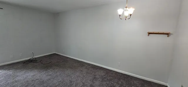 a view of a room with a hanging light