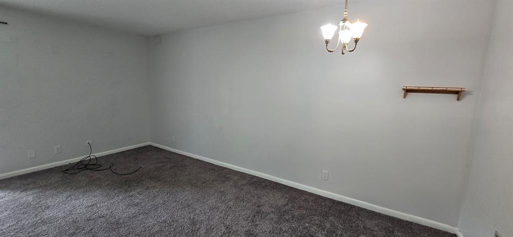 3321 Southwest 34th Ave Circle, Unit 5 Ocala, FL 34474 - Photo 5 of 10 a view of a room with a hanging light