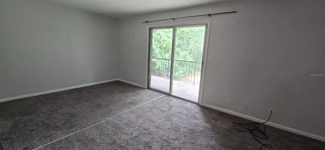 an empty room with a empty space and a window