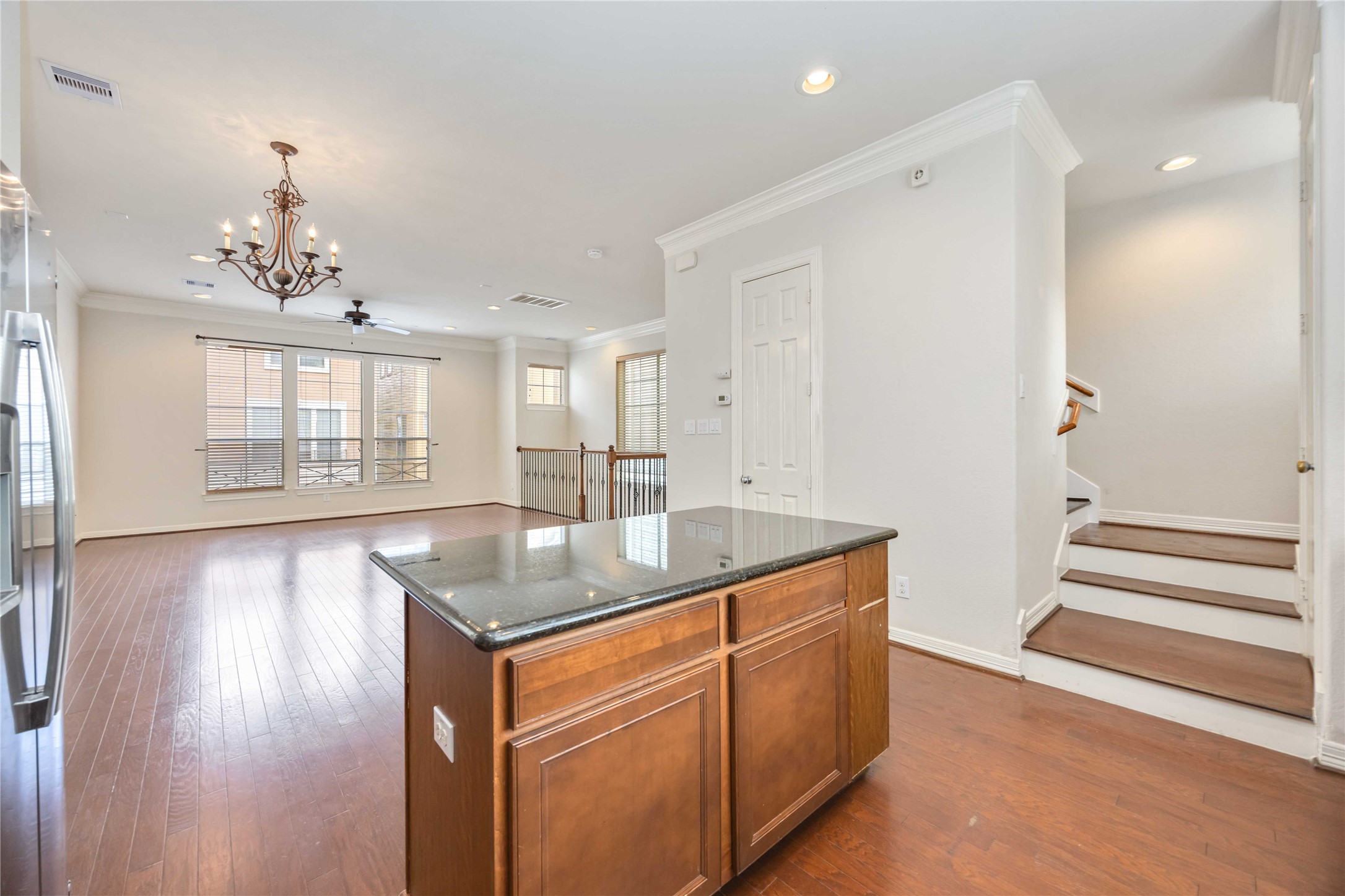 3008 Clearview Circle Houston, TX 77025 - Photo 13 of 33 a kitchen with stainless steel appliances granite countertop a sink dishwasher and a wooden floor