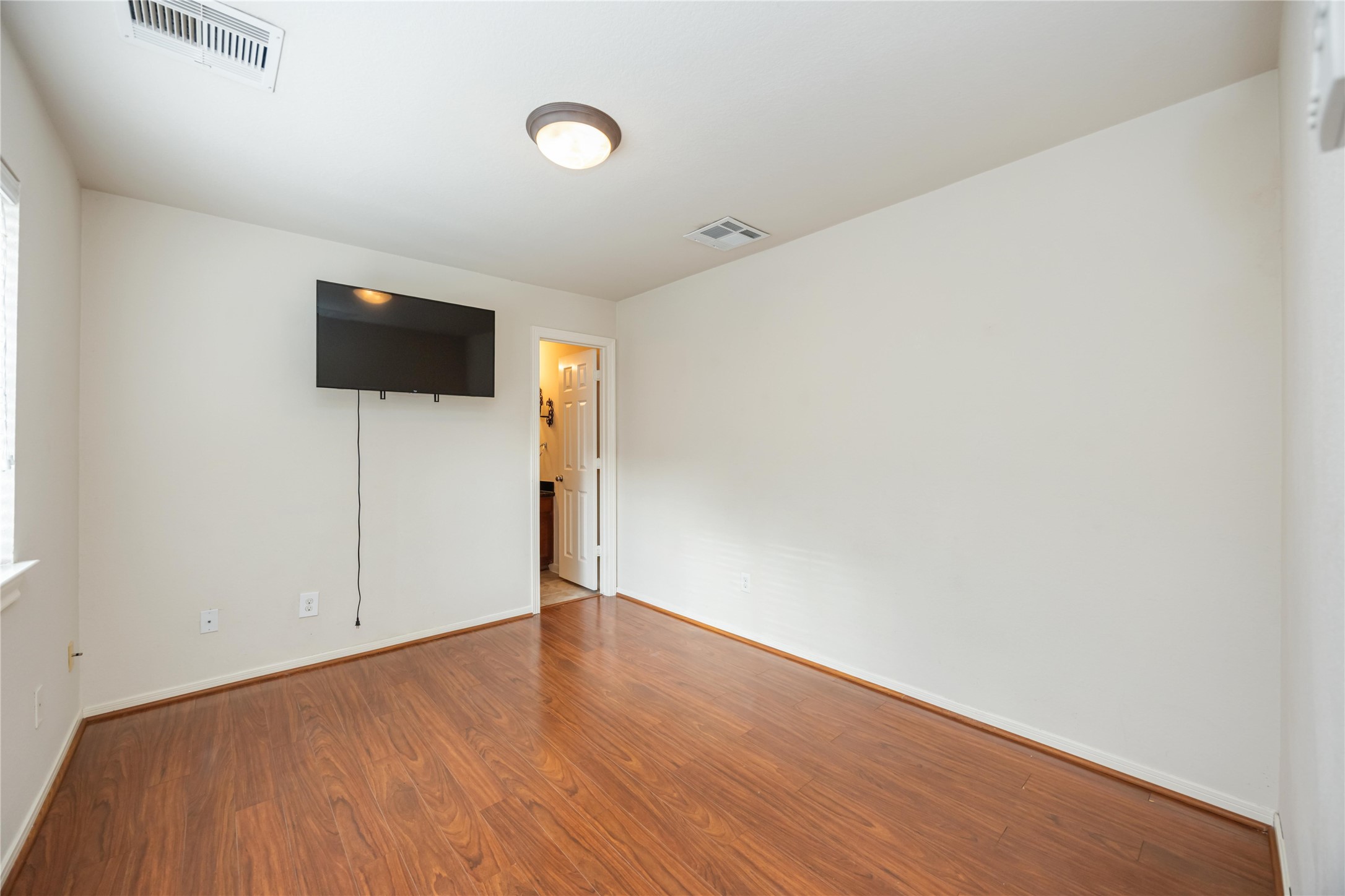 3008 Clearview Circle Houston, TX 77025 - Photo 18 of 33 a view of a livingroom with wooden floor