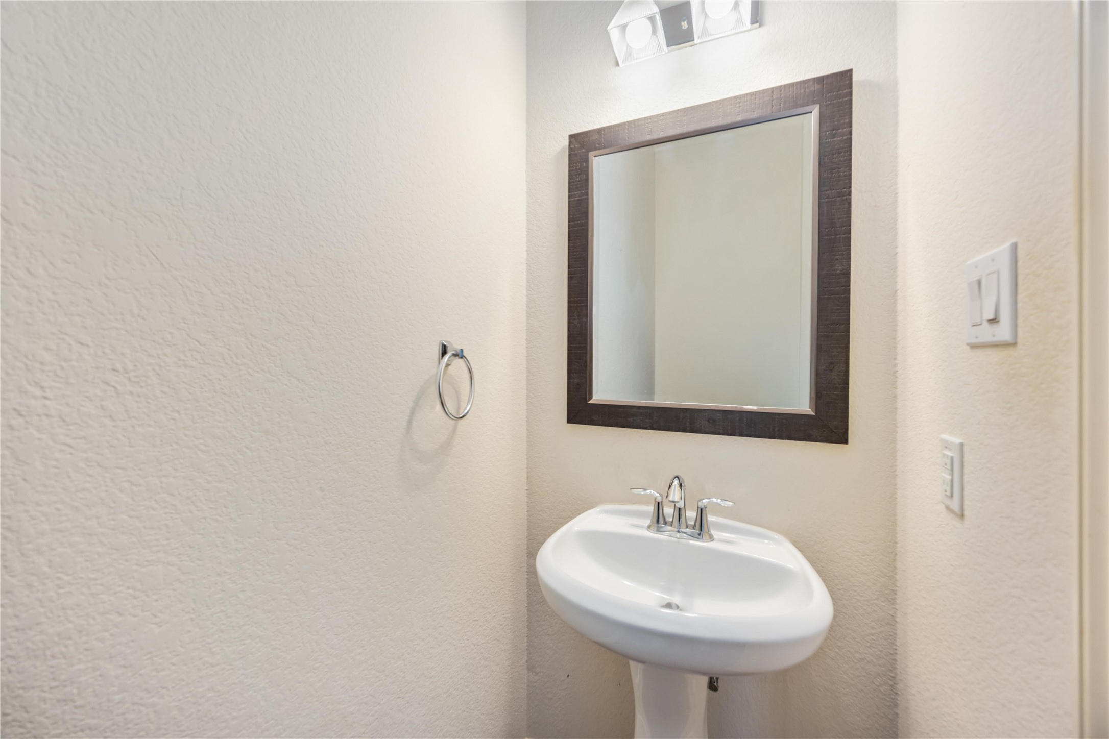 3008 Clearview Circle Houston, TX 77025 - Photo 20 of 33 a bathroom with a sink and a mirror