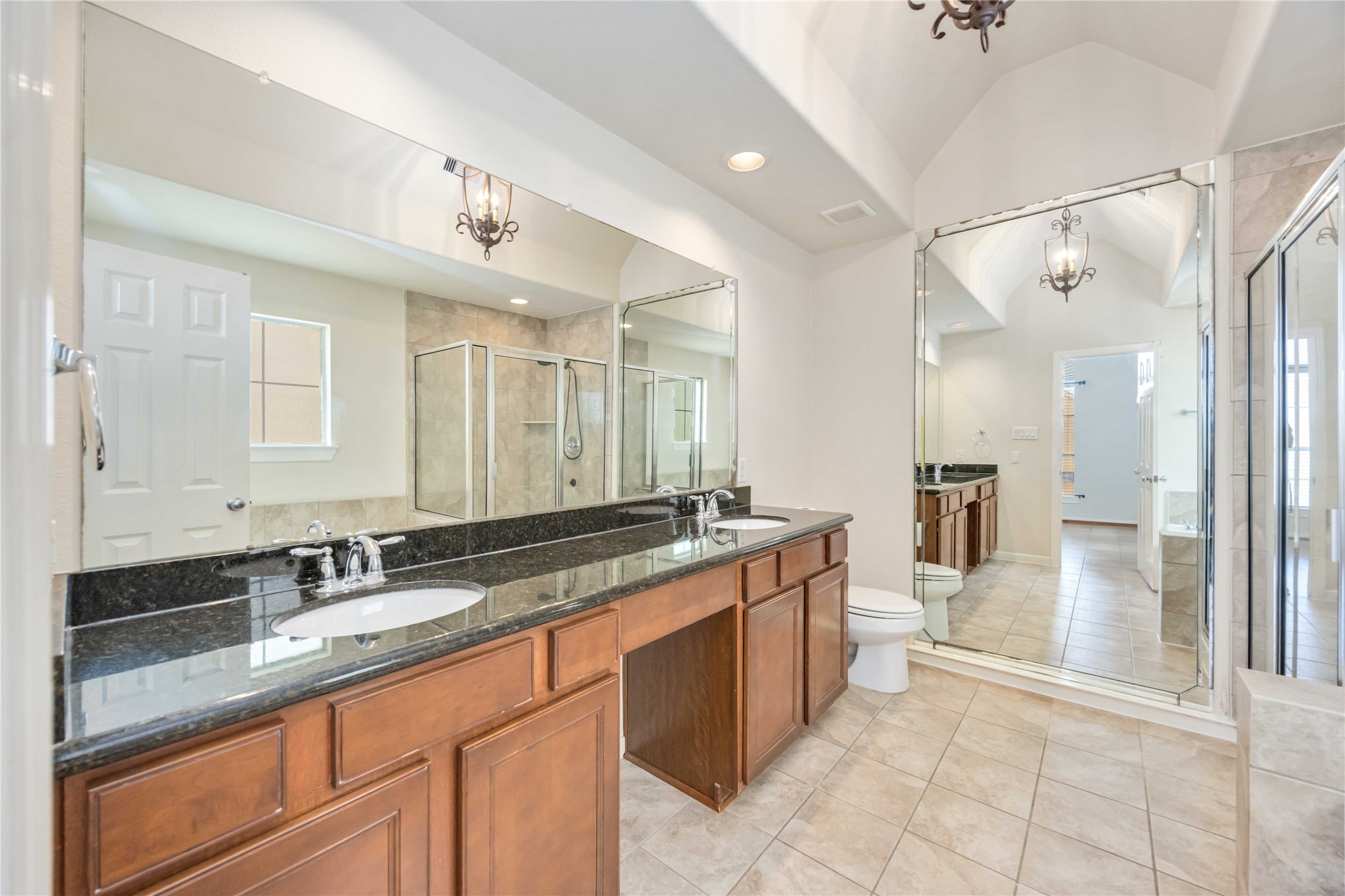 3008 Clearview Circle Houston, TX 77025 - Photo 23 of 33 a large bathroom with a granite countertop sink mirror and a