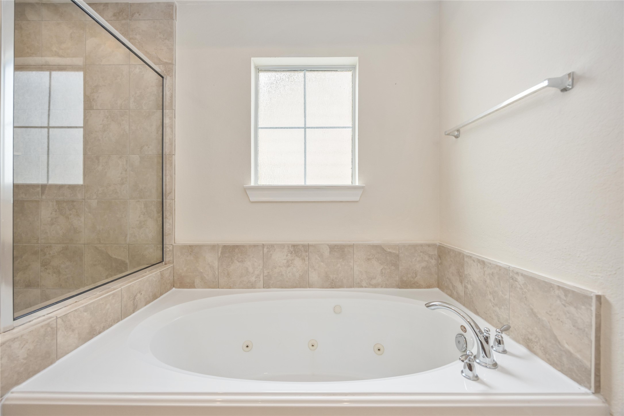 3008 Clearview Circle Houston, TX 77025 - Photo 25 of 33 a bathroom with bathtub and window