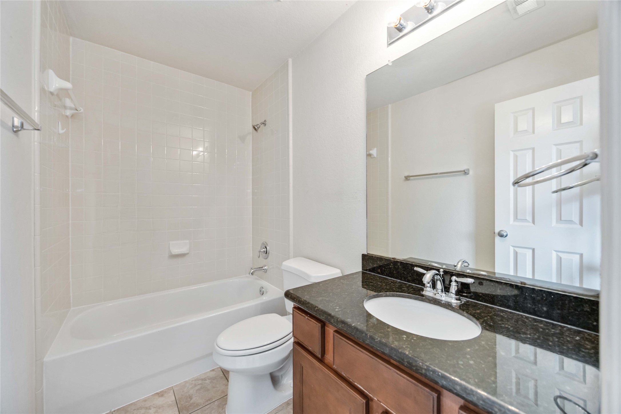 3008 Clearview Circle Houston, TX 77025 - Photo 30 of 33 a bathroom with a sink a toilet a mirror and bathtub