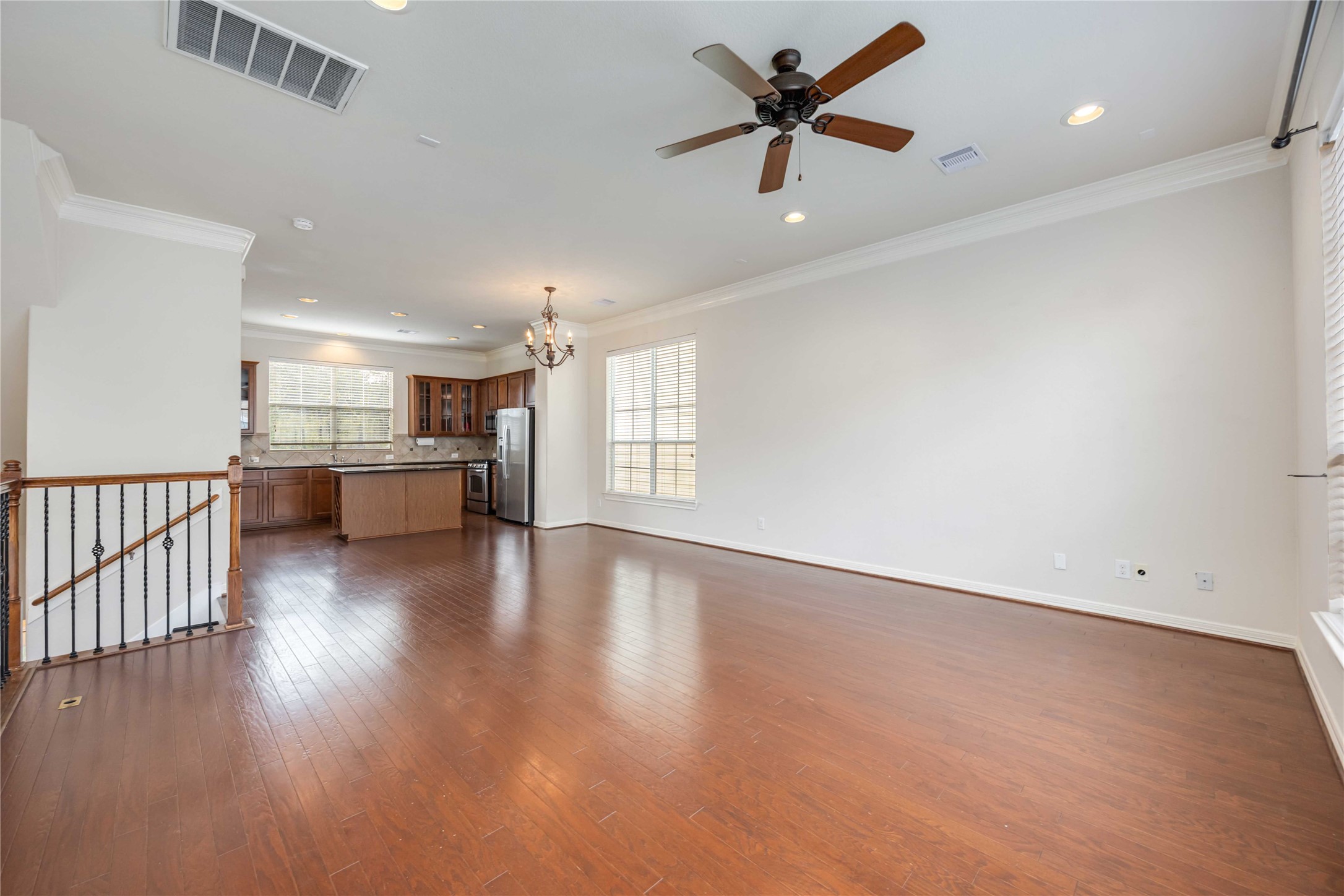 3008 Clearview Circle Houston, TX 77025 - Photo 8 of 33 an empty room with windows and ceiling fan