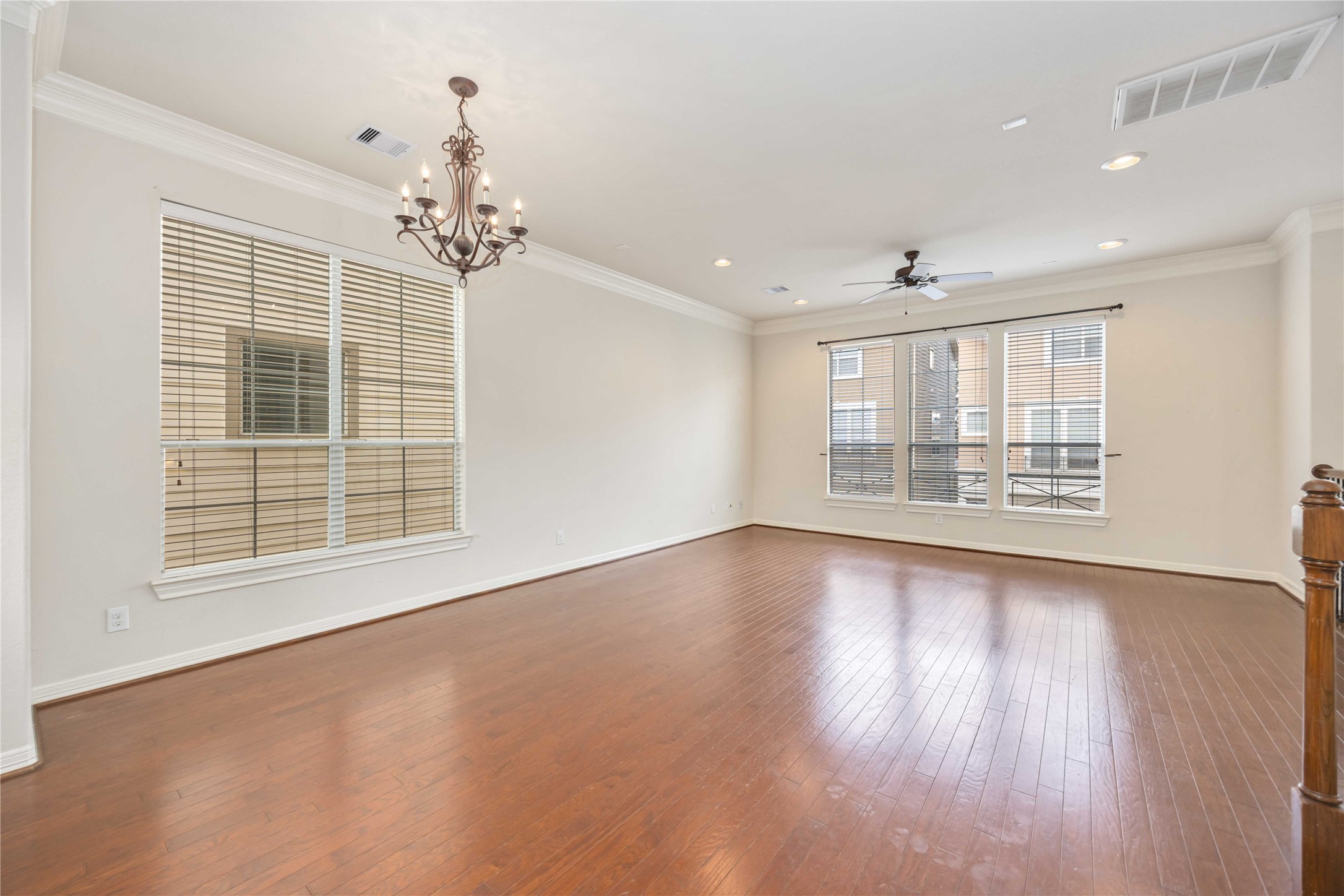 3008 Clearview Circle Houston, TX 77025 - Photo 9 of 33 a view of an empty room with a window and wooden floor