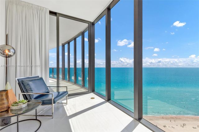 a balcony with chairs