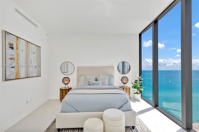 a bedroom with bed and a lamp