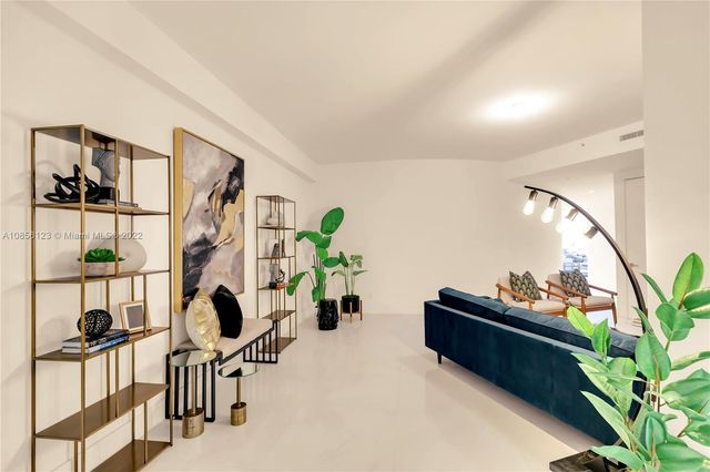 a bathroom with a granite countertop sink mirror and a bathtub