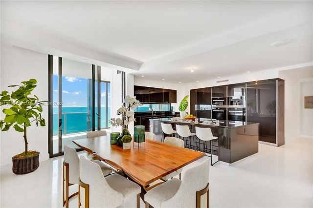 a living room with furniture floor and a flat screen tv