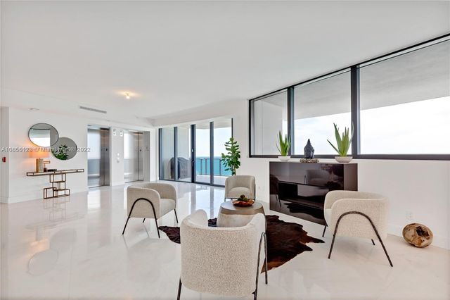 a kitchen with stainless steel appliances kitchen island granite countertop a sink and cabinets