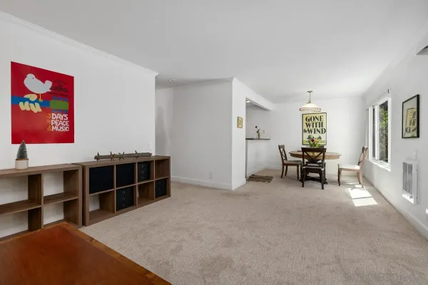 a view of a livingroom with furniture and workspace